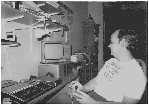 1983 picture of Stephen Shaw and his TI-99/4a computer with his Epson FX-80 printer in the background